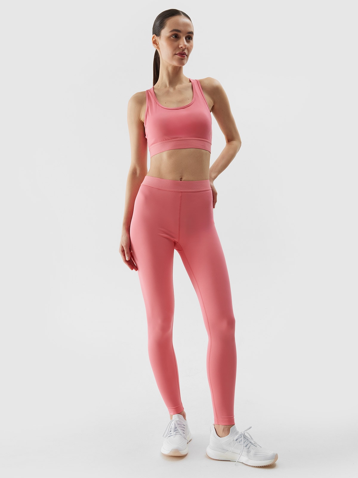 Moteriškos treniruočių tamprės iš perdirbtų medžiagų - koralų spalvos