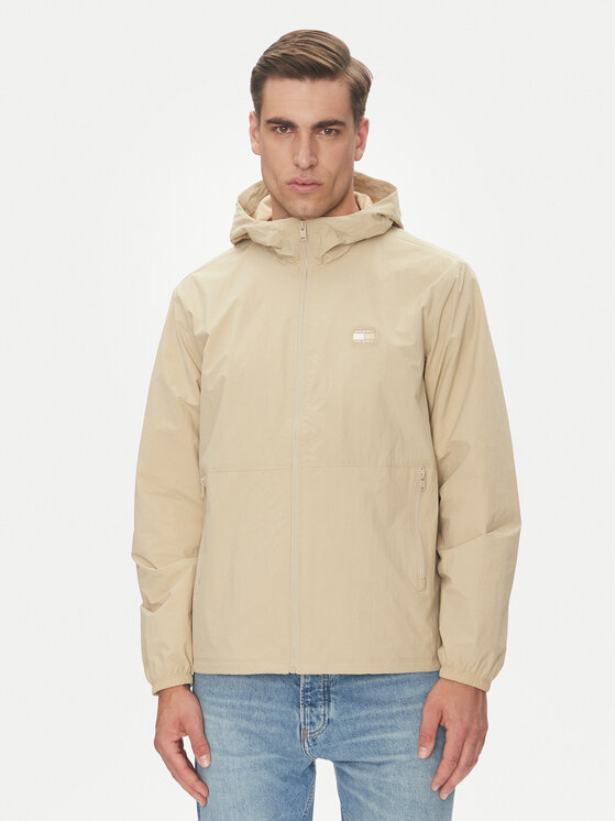 Tommy Jeans Neperpučiama striukė · Smėlio